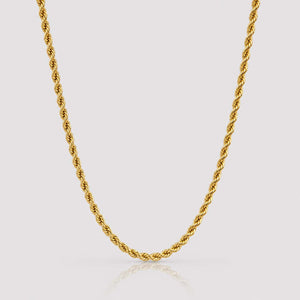 A gold twisted rope chain necklace displayed in a U-shape against a light gray background with a subtle reflection below.