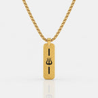 A gold-toned rectangular pendant necklace with a black Trishul symbol in the center, suspended from a matching gold chain against a light gray background.