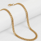 Gold chain necklace on a white background