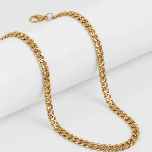 Gold chain necklace on a white background