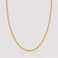 Gold chain necklace on a light gray background