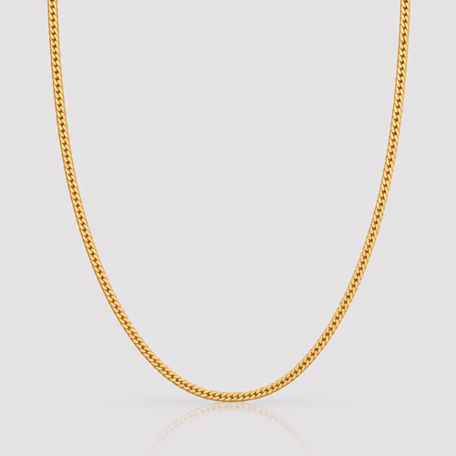 Gold chain necklace on a light gray background
