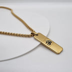 Close-up front view of Om Pendant Dotted Design gold necklace