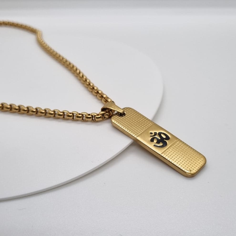 Close-up front view of Om Pendant Dotted Design gold necklace